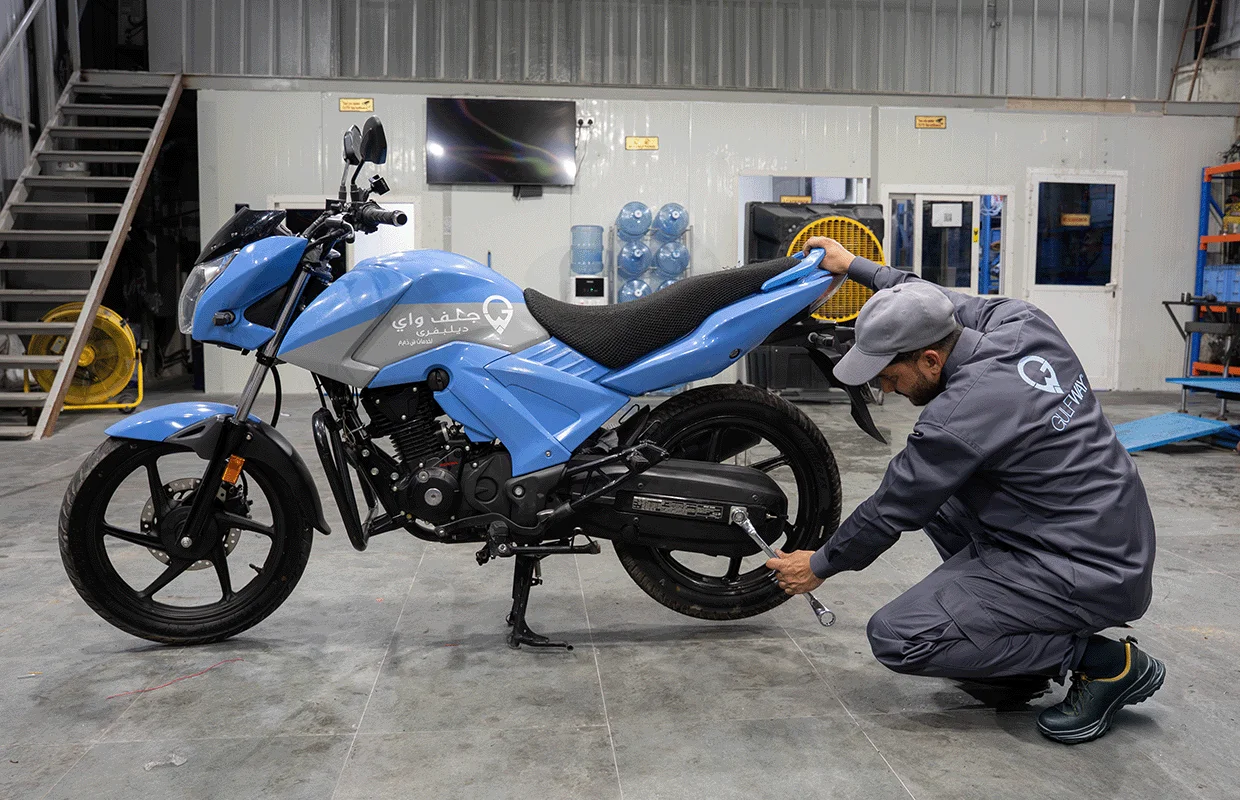 Mechanic Fixing the Wheel of Bike