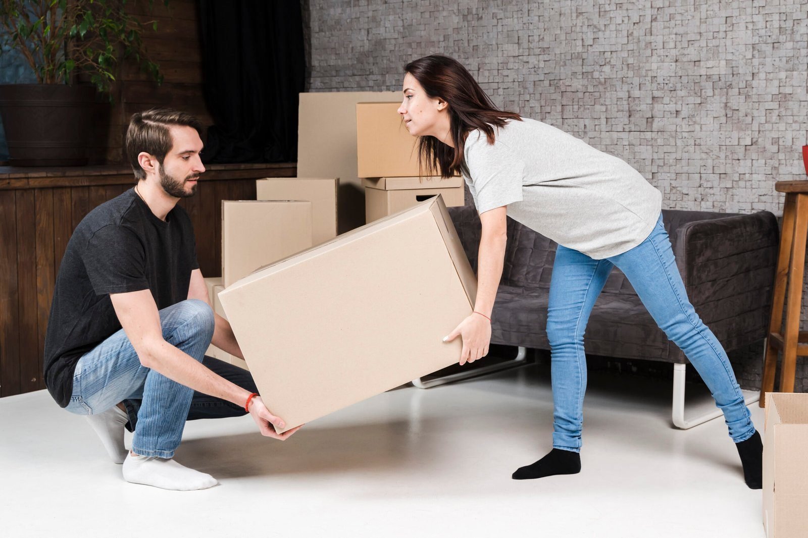 Emirates Way Cargo Team Member of movers carefully handling furniture during a residential move